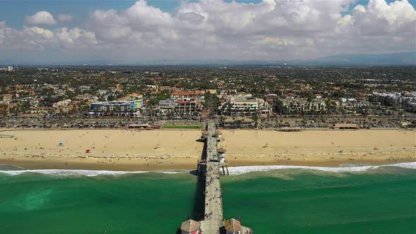 Drone footage flying over Huntington Beach pier