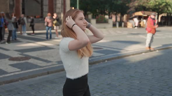 Young Woman Walking In Square In Prague