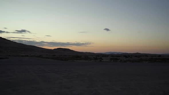 Beautiful view from a car of a vivid sunset in the Little Sahara desert in Central Utah.