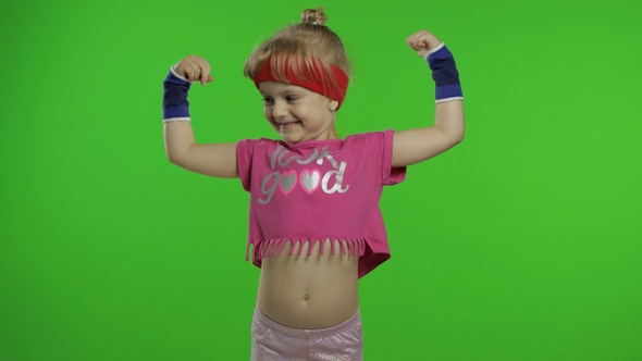 Athletic Girl in Pink Sportswear Showing Muscles Isolated Over Green Screen, Chroma Key Background