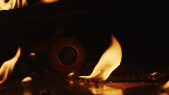 A skateboard wheel and flames