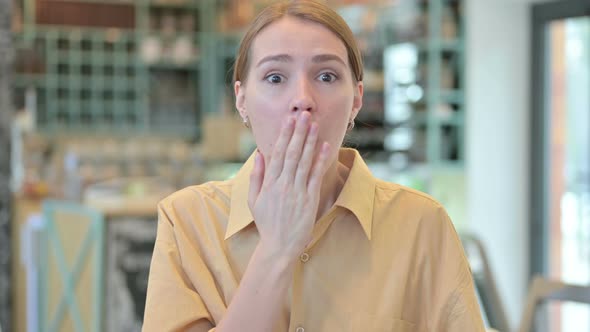 Portrait of Young Woman Feeling Shocked By Loss