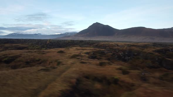 Flying over moss at sunset in Iceland