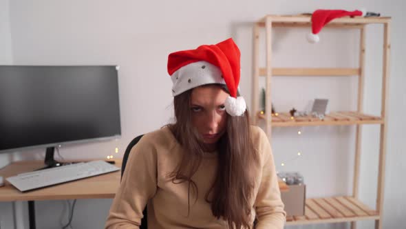 CAucasian Young Woman in Office After Corporate Celebration of Xmas New Year. Drunk After Party Girl