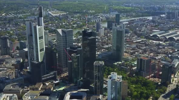 AERIAL Above Frankfurt Am Main with Drone Looking Down on Skyscrapers in Beautiful Summer Sunshine