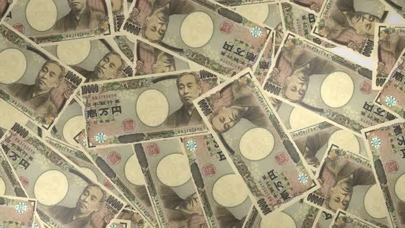 10000 Japanese yen bills background. Many banknotes.