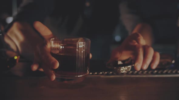 Bartender Serves Cocktail with Chocolate