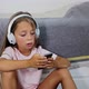 Cheerful Child Listening to Music in Headphones - VideoHive Item for Sale