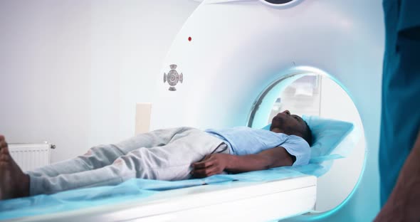 Black Patient Talking with Doctor About CT Scan