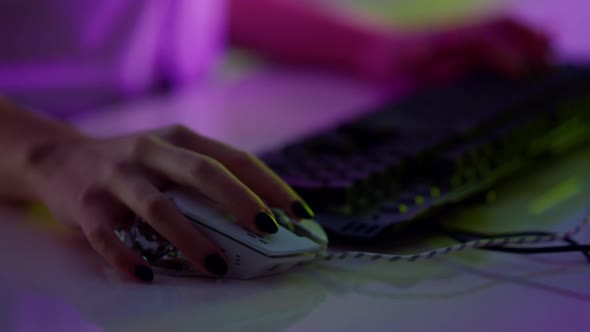 Gamer Hands Typing Keyboard in Neon Cyberspace Closeup