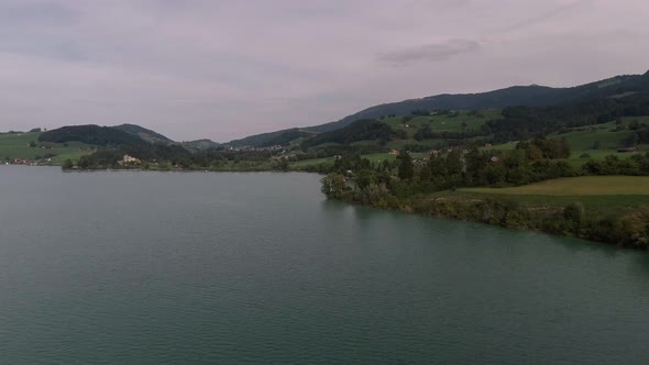 Flight Over The Lake In Cloudy Day, Lake Gruyère, Switzerland