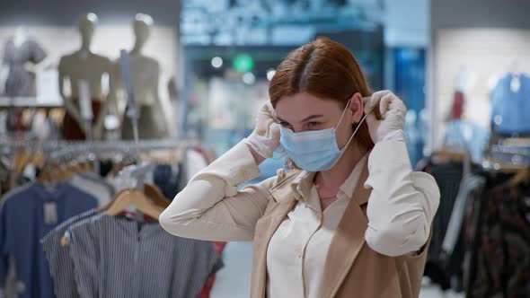 Virus Protection, Portrait of Smiling Girl in Medical Gloves Putting Mask on Her Face in Clothing