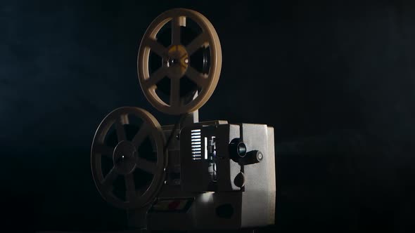 Closeup of a Vintage Movie Projector. Projection Rays in Move