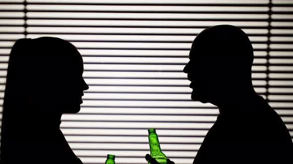 Man and Woman Drinking Beer on White Striped Background