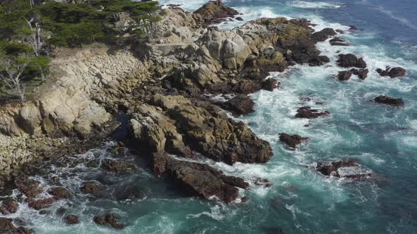 Backwards Aerial Pan Big Sur Rocky Coastline in California