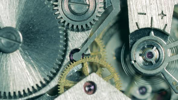 Rotating Metal Cogs in a Clockwork Drive