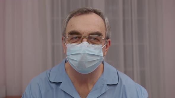 Senior Man Wore in Medical Mask at Camera