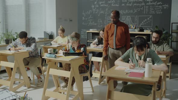 Professor Helping Students with Test