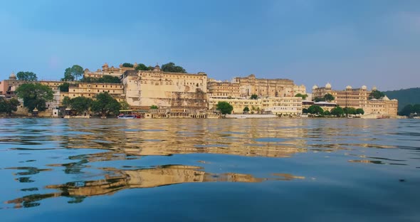 Udaipur City Palace on Lake Pichola with Tourist Boat - Rajput Architecture of Mewar Dynasty Rulers