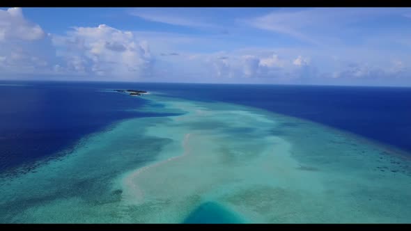 Aerial top down scenery of tropical coast beach vacation by turquoise ocean with clean sand backgrou