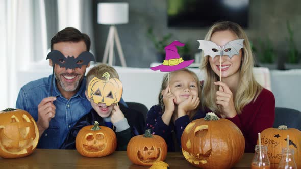 Portrait of happy family spending Halloween together at home