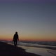Silhouette of an Independent and Modern Woman Photographer a Travel Correspondent Walks on Beach of - VideoHive Item for Sale