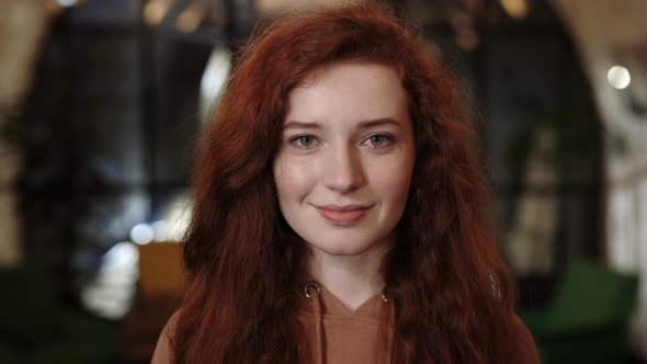 Crop View of Cheerful Red Haired Woman Smiling and Looking to Camera