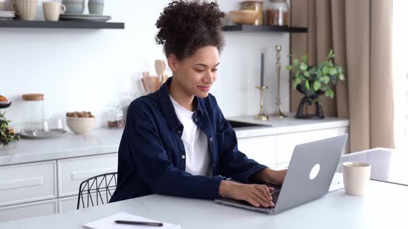 Positive Lovely Smart African American Girl in Casual Wear Freelancer Student or Creative Designer