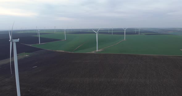 Wind Farm Green Energy Production Field, Aerial Approaching Drone