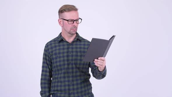 Angry Blonde Hipster Man Reading Book with Eyeglasses