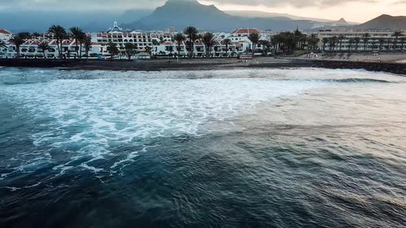  beautiful slow motion wave on the yellow sand beach in tenerife while a long oceanic foam