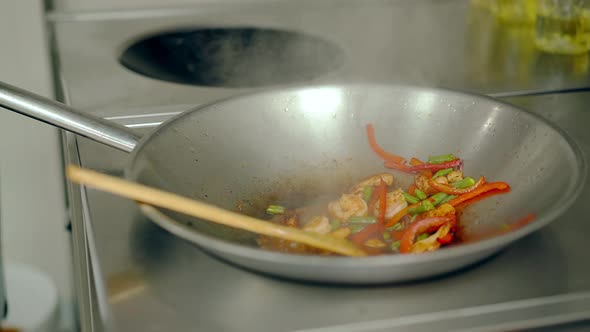 Close Up Frying Pan with Oil and Vegetables Cooking Fajitas