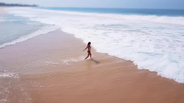 Asian Woman Feet Walking Barefoot Beach at Endless Ocean Seaside Leaving Footprints in Sand