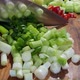 Chopping vegetables on a wooden board. - VideoHive Item for Sale