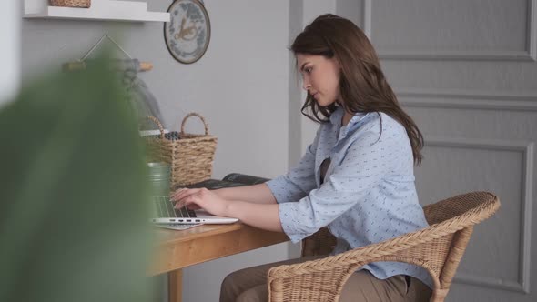 Portrait of a Freelancer Girl Working at Home