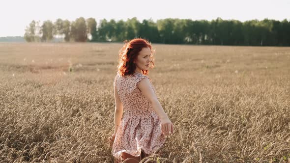 Beautiful Young Girl at Sunset Field