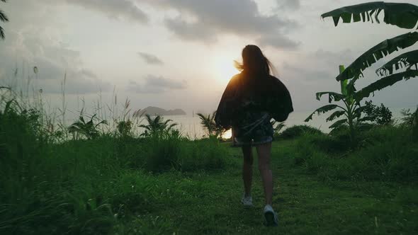 Cute Asian Girl in Kimono Running to Beach at Sunset in Slow Motion Thailand