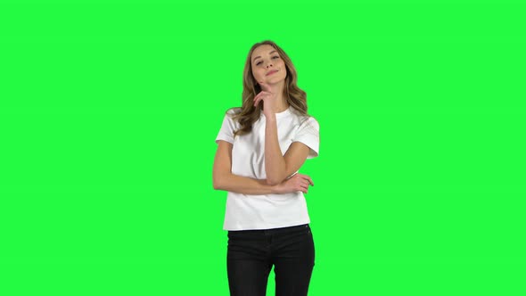 Lovable Girl Coquettishly Smiling While Looking at Camera. Green Screen