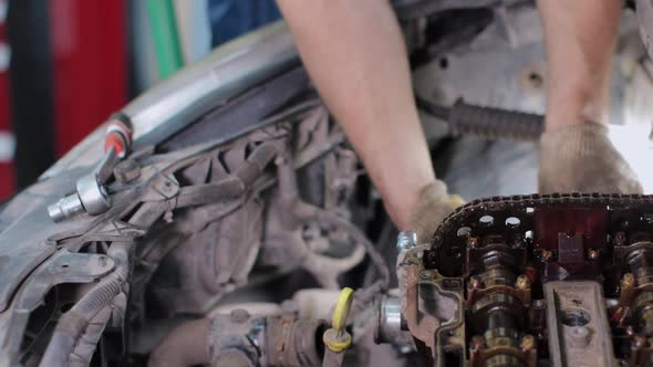 Car mechanic working in service center