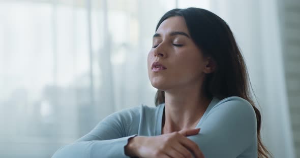 Close Up Portrait of Young Upset Woman Deep Breathing and Hiding Face in Hands, Slow Motion