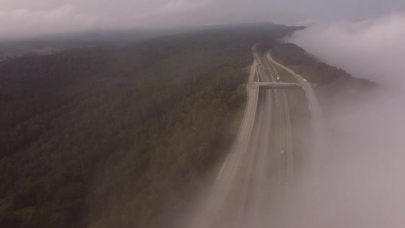 Interstate 75 In Rarity Mountain Road With Vehicles Traveling By Dense Forest Valley During Misty Mo