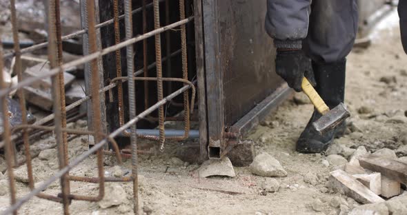 Engineers Work with Metal Constructions While Building a House