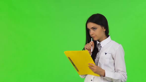 Young Businesswoman Filling Papers, Posing on Chromakey 1080p