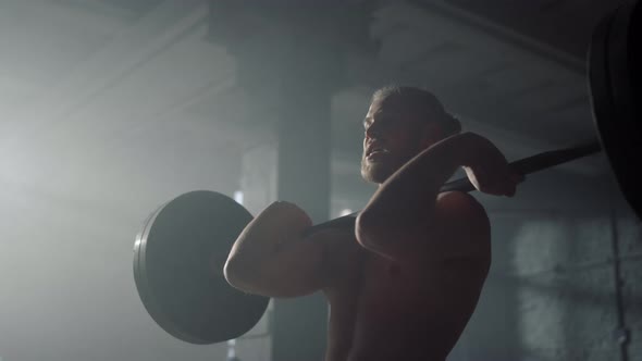 Powerlifter Lifting Weights in Gym