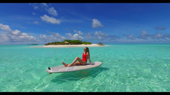 Guy and girl happy together on idyllic tourist beach journey by transparent ocean and white sandy ba