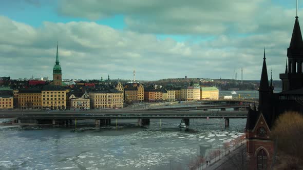 MOTION TIMELAPSE ZOOM IN, an ice breaking boat in front of the old town, Stockholm, Sweden