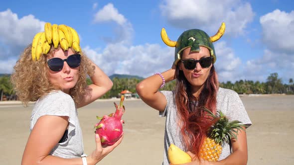 Two Funny Multiracial Girls Friends Having Fun On Summer Beach
