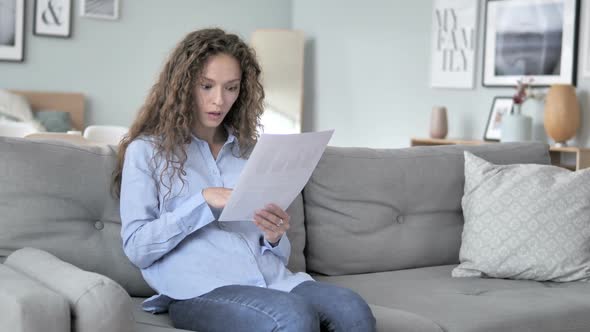 Curly Hair Woman Feeling Upset While Reading Contract Documents