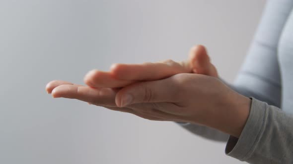 Close Up of Woman Spraying Hand Sanitizer