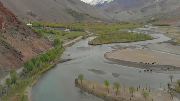 Aerial View Over Riverbend Of Ghizer River With Valley Landscape In The Background In Pakistan